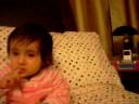 Tied in a sac so that she doesnt crawl out of the bed. Teething still all 4 fingers inside the mouth.