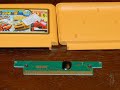 a *really* cheap famicom cart that displays scrambled graphics in my nes, but works fine in my fc mobile ii. this cart contains mad max, road blasters, ferrari grand prix challenge, and race america. it has the cheapest plastic i've ever seen on a game cartridge, as it even fell apart when removing it from the famicom adapter. $3 was a fair price for them at ndscardsale.com, but it doesn't really feel like a huge bargain. i've got more of these, so i'm sure there will be more videos in the future.