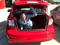 Tall Woman in Trunk of Suzuki SX4 at Bryan Suzuki