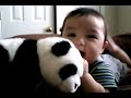 Andrew playing with his stuff panda bear.