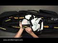 Find 32 more videos at http://www.AssignmentConstruct.com .Transcript of this video:Hi, I'm John Harrington and we're going to break out and break down the wide variety of equipment we use to deliver images to our clients. Next we are going to show you one of the equipment kits we use when we are traveling on assignment. Each kit is different and has a very specific purpose. So lets take a look. We love the California Sunbounce Kits we use.  We used to have some plastic frames, but they just didn't do the trick. We have in here the Sunbounce, the Sunbounce Pro, and the SunSwatter. All of them fit nicely and neatly into this one unit.On the sides are individual pouches, which hold gold reflectors on one side and white on the other. We have various translucents.  One translucent here, is a little thinner than this translucent over here. This translucent here, as we've labeled it ourselves, knocks it off 1/3 of a stop, this translucent over here knocks it off 2/3 of a stop, so you can see the difference in density between these which just cuts off more light or a little less light. In addition, in this kit, is an arm, nicely accompanied by a ball, so that when you have it braced upon your waist here, you're actually not digging into your hip with the metal on the end it's got a ball and it came with it that way which is really nice. It's actually a Bogen avenger that California Sunbounce has modified.  Also in here is a boom arm with a Hollywood Head on the end. It's a Bogen avenger. You can attach another boom arm onto the top of this stand The boom arm slips in and will attach to the SunSwatter or Sunbounce Pro, any one of the units, all here. You can get this up above your subject if you need to. Okay, so in this pack is the Sunbounce pro, the straight Sunbounce, an extra Sunbounce, and the SunSwatter all of this allows us to work really effectively when we're not using any flash whatsoever. We used this once on an assignment in Chicago out in the middle of nowhere where we had no power and trekking all the way to the location where we needed to be was just not going to work with the Porties. So that's the California Sunbounce kit.