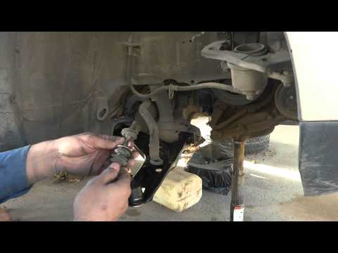 Lower suspension arm replacement. Car suspension repair. DIY fix.