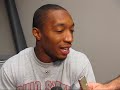 Beanie Wells and others speak with the press