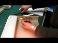 I finish covering the small tray walls and use it to make the large tray.