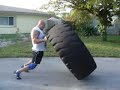 Milan tire flip 950 lb (430 kg) x 11 Milan tire flip 950 lb (430 kg) x 11