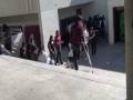 injured student takes a mighty fall down a crowded staircase