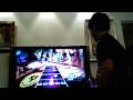 My brother is playing Guitar Hero