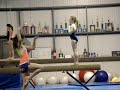 Kaity doing some cartwheels on the beam at practice.