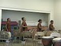 famoudou konate performing with kids in hooked on drums program sponsored by the chicago djembe project at kennicott park, chicago 2003