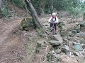 Girl MTB down rocky trail in Maokong Trail, Taiwan Girl MTB down rocky trail in Maokong Trail, Taiwan