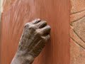 Tiebele women painting their houses