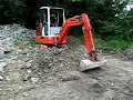 Schaeff HR14 Mini digger tidying up some stone pt3