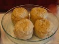 In this video, Betty demonstrates how to make one of the desserts of her dinner train ride--Old Fashioned Apple Dumplings. This dish is a hearty dessert, with each serving being an entire apple, filled with butter and spices, and encased in pastry. The apples are then baked in syrup until the syrup is thickened and the pastry is browned and flaky. Wonderful!!! Ingredients: 1 recipe pastry for a double-crust pie, made into dough 4 large Granny Smith apples, peeled and cored (Don't core all of the way through the apple, just most of the way toward the bottom.) 6 tablespoons butter, divided into 4 single tablespoons and an additional 2-tablespoon cube, softened to room temperature ½ cup light brown sugar 1 teaspoon ground cinnamon ½ teaspoon ground nutmeg 2 cups water 1 1/3 cups white sugar 1 teaspoon vanilla extract vanilla ice cream or whipped topping (optional) Butter a deep dish pie plate (or other appropriate baking dish) and set aside. On a lightly floured surface, roll out the pastry dough into a large 16-inch by 16-inch square. Cut the large square into four 8-inch by 8-inch squares. Place a prepared (partially cored) apple at the center of each pastry square with the cored opening facing upward. Place 1 tablespoon of butter in the opening of each apple. Divide brown sugar among apples, placing some inside each cored opening and the rest around the base of each apple. Sprinkle cinnamon and nutmeg over the apples, until the measured amounts have been used. With <b>...</b>