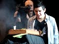 david is surprised with a birthday cake from his band and the crowd sings happy birthday!!