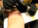 Me getting my sons name tattoed on my arm.