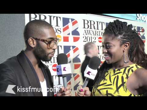 Tinie Tempah on the red carpet at the BRIT Awards with KISS