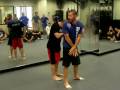 Krav Maga defense for bear hug from behind arms caught