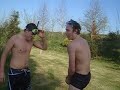 jack and john jumping into john's pond to fish out a croquet ball that john lost by hitting it into the pond trying to win the game. he is a loser.