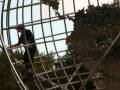 Guy on Trump Tower Globe @ Columbus Circle New York
