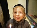Shmuel lights the menorah