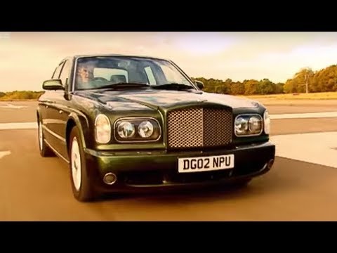 his fingers over the motor cathedral that is the Bentley Arnage T before