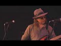 gallows pole -- trad. arr. rootdogs.

twelfth century english / scottish border ballad meets percussion driven funk.

reg. prs & mcps
pub. by accolade music

this is the third video from rootdog's summer 2007 concert at new greenham arts.

hi-jinks abound in this dramatic conclusion to their set -- look out for the expression on domo's face during his drum solo!

also known as 'the maid freed from the gallows' or 'the prickly bush' (child 95)  this song has been collected in many versions throughout england, ireland and scotland as well as in the united states -- where ledbelly (hudie ledbetter) recorded a fantastic version for alan lomax in 1939.

the most famous version was recorded in 1970 by led zeppelin on led zep 3 -- which was based on the ledbelly version.

richard thompson did a really good re-write of the theme around the time of the fairport convention album 'full house' -- he called his song 'poor will & the jolly hangman' -- i don't think it made it onto the album but you can hear it on the lp / cd 'the electric muse' if you can find a copy anywhere.

i first heard the song sung by a.l. lloyd on a topic lp called scottish border ballads when i was about 16 years old. at that time i was spending much of my 'school' days either in the hereford library or the queen's arms pub picking up as many songs and tunes as i could, having just discovered folk music.

over the years my 'pure' version of the 'gallows pole' has become much corrupted by the other versions i have listened to ... and a good thing too i say... the folk process lives!

the video cut-ins were filmed at coombe gibbet -- possibly the only gallows still in existence in england -- and a very unusual one!

mark t.

here is more about coombe gibbet from simon topham's web-site:

combe gibbet stands on the top of combe down, and was erected on top of a neolithic burial mound. it was only ever put to its grisly use once in 1676: 

george broomham of combe, and dorothy newman of inkpen were lovers. they brutally killed martha and robert broomham, george's wife and son, who had come across them together on the downs. unfortunately for them they were seen committing the crime by the barefoot village idiot 'mad thomas' who managed to convey what he had seen to the authorities. 

they were both tried and then hanged at the winchester assizes. their dead bodies were hung on either side of the combe gibbet to act as a grim deterrent to other would be wrong doers.

most gibbets have just a single side for the body to be hung on, but this gibbet is a double one! it's worth noting that the gibbet, though in berkshire is situated near to the county borders of hampshire and wiltshire.