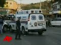 Bank Gunmen Escape in Ambulance
