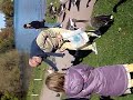 Crazy old man slaps a duck