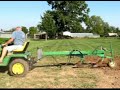 JD 318 plowing with 2 bottom semi-mounted plow