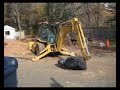 Cat backhoe crushes chair