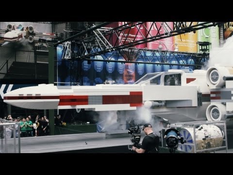 Square - LEGO unveiled a Star Wars X-Wing Starfighter construction set in Times Square. It is 11-feet tall, 43-feet long, weighs over 46000 pounds, and consists of o...