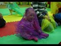 Baby Natalie playing with scarves