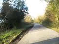 Going a bit fast along a lane on a Moulton