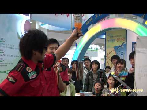 Handsome bartenders performs cocktail flair show