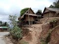Cycling through a Hmong village on the road from Vientiane to Laung Prabang.
