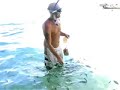 Feeding fish in Thailand 2