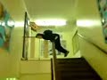 Luke slideling down a banester at school