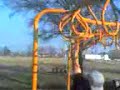 Doing the monkey bars at Chouteau Park