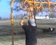 Doing the monkey bars at Chouteau Park