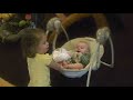 Ella pushing Luke on the swing
