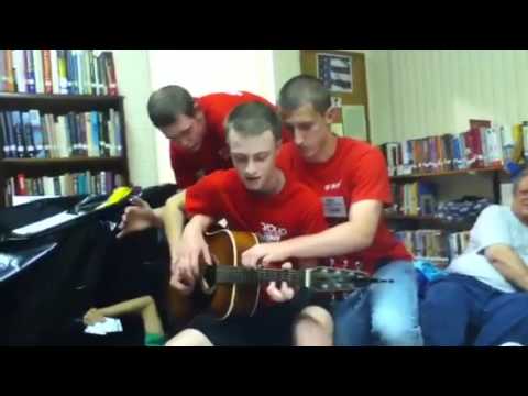 3 guys 1 guitar - 3 lonely men playing with each other.