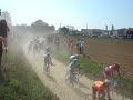 Peloton go through Troisvilles - Paris Roubaix 2007