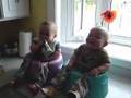 Twins Giggling in Bumbos