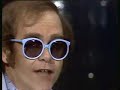 Elton John - Little Jeannie 1980(this clip was part of a comedy show)Oh little jeannie, you got so much love, little jeannieAnd you take it where it strikes and give it to the likes of meOh little jeannie, she got so much love, little jeannieSo I see you when I can, you make me all a man can beAnd I want you to be my acrobat, I want you to be my loverOh there were others who would treat you cruelAnd oh little jeannie, you were always someones foolLittle jeannie, you got so much time, little jeannieThough youve grown beyond your years, you still retain the fears of youthOh little jeannie, you got so much time, little jeannieBut youre burning it up so fast, searching for some lasting truthAnd I want you to be my acrobat, I want you to be my loverOh there were others who would treat you cruelBut oh jeannie, I will always be your fool