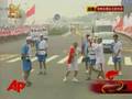 Raw Video: Quake Rescuers Carry Torch