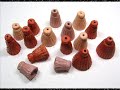 an informative and concise look at forming a hollow clay bead and then trans-forming it into a pair of bell-shaped tassel focal beads.