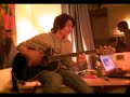 Belton playing a left handed guitar, completely wasted