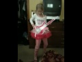 Ari plays guitar
