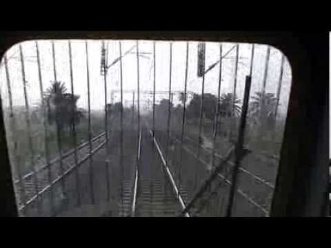 Howrah Rajdhani - Loco pilot showing flag to passing station, confirming signals with co pilot and finally @130kmph overtaking a long distance passenger train pulled by WAP4. ...