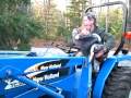 Baby Beatrix taking her first ride on tractor with Grandpa Rick